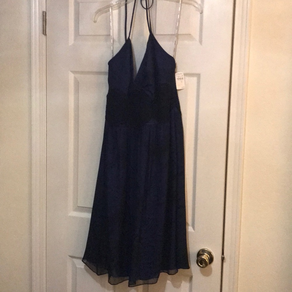 Halter top cocktail dress. Mid thigh length.